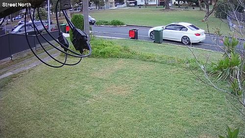 A white BMW of interest drives away from Colechin Reserve at Yagoona.