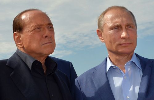 Russian President Vladimir Putin and former Italian Prime Minister Silvio Berlusconi