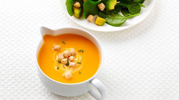 Roasted pumpkin soup with avocado and spinach salad