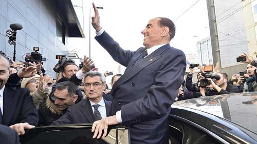 Silvio Berlusconi waves at supporters. (AAP)