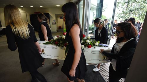 Mourners carry murdered mother Tara Brown's coffin