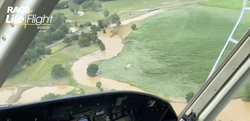 A swollen river is seen from the RACQ chopper during a flight over Gympie.