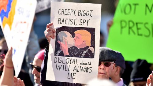 Many of the signs were highly critical of US President Donald Trump. (PA)