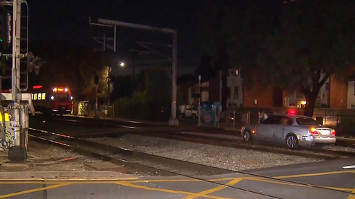 A train driver's quick reflexes have helped avoid disaster, after an elderly driver became stuck on the tracks in Adelaide.