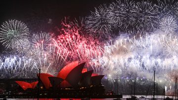  Fireworks explode over the Sydney Harbour Bridge and the Sydney Opera House in the midnight display during New Year&#x27;s Eve celebrations on January 1, 2020 in Sydney, Australia