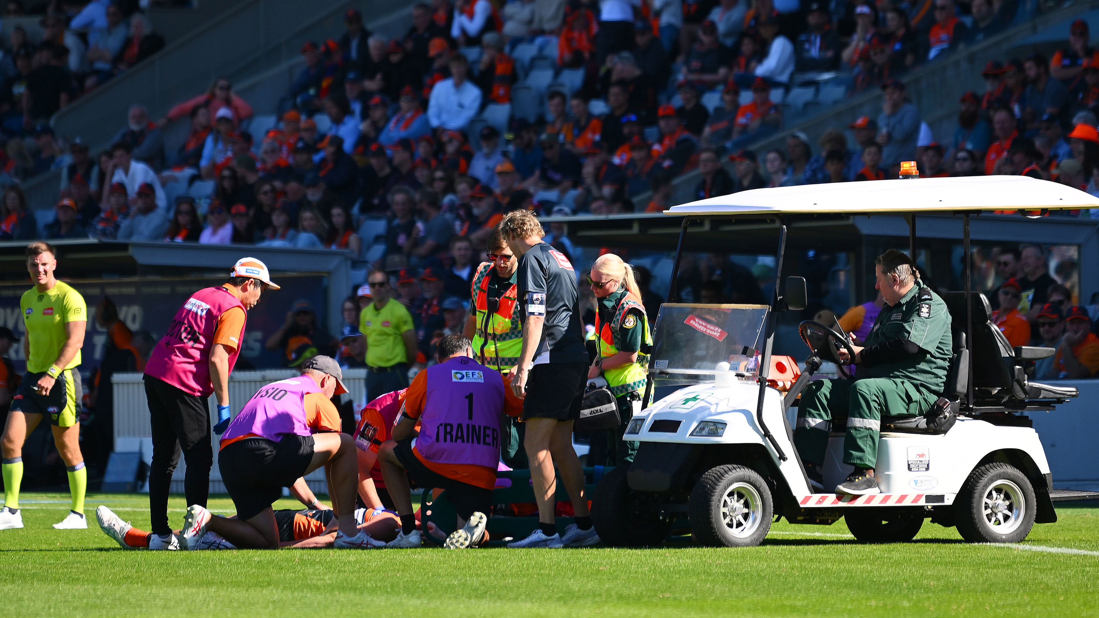Sam Taylor receives medical attention during the round five AFL match between the GWS Giants and the St Kilda Saints.