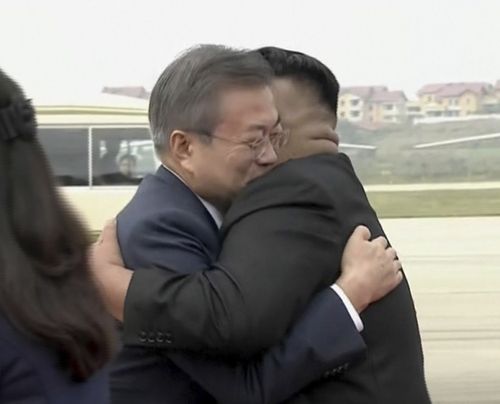 South Korean President Moon Jae-in, left, hugs North Korean leader Kim Jong-un upon arrival in Pyongyang, North Korea