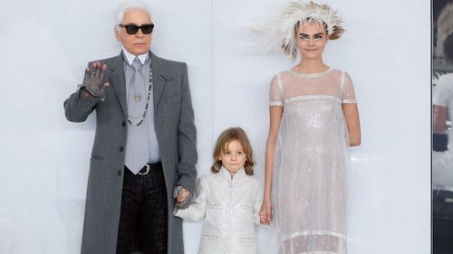 Cara Delevingne with Karl Lagerfeld. (Getty)