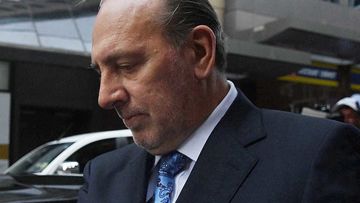 Brian Houston leaves the Downing Centre Court.