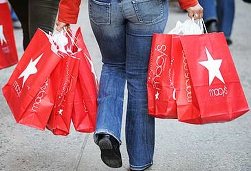 Woman carrying Macy's shopping bags (AFP)