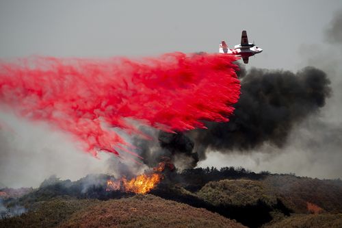 An air tanker drops retardant on a wildfire burning near Lakeport, California. Picture: AAP