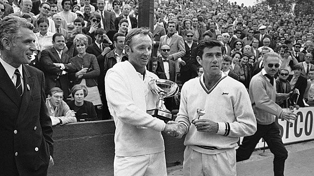 Ken Rosewall, right, congratulates Rod Laver, left, at the French open in Paris, June 7, 1969. Laver defeated Rosewell in three sets. (AAP)