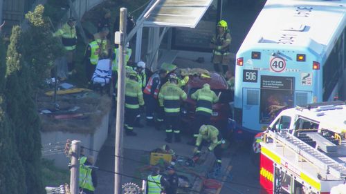 Two people are in hospital after a car crashed into a bus shelter in Drummoyne, Sydney.