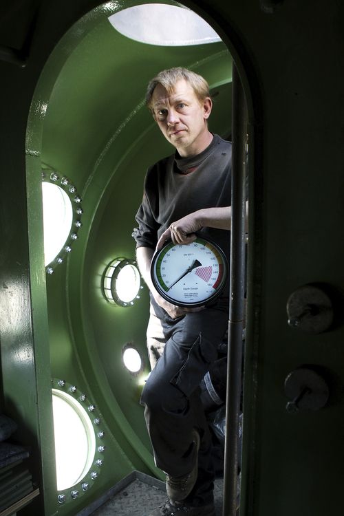 The submarine owner stands inside a vessel in 2008.