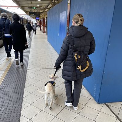 Casey takes Flossy everywhere, including busy train platforms.