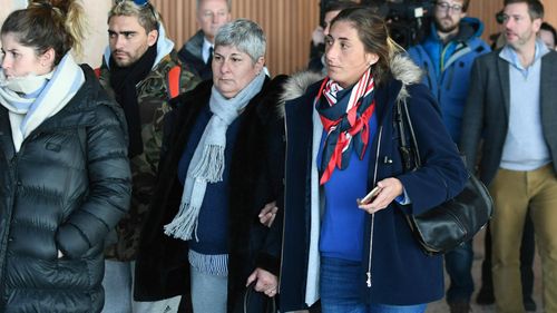 Emiliano Sala's mother Mercedes, centre left and sister Romina arrive back at Guernsey airport after taking a flight to view the area of the English Channel in which the missing footballers plane was last seen.