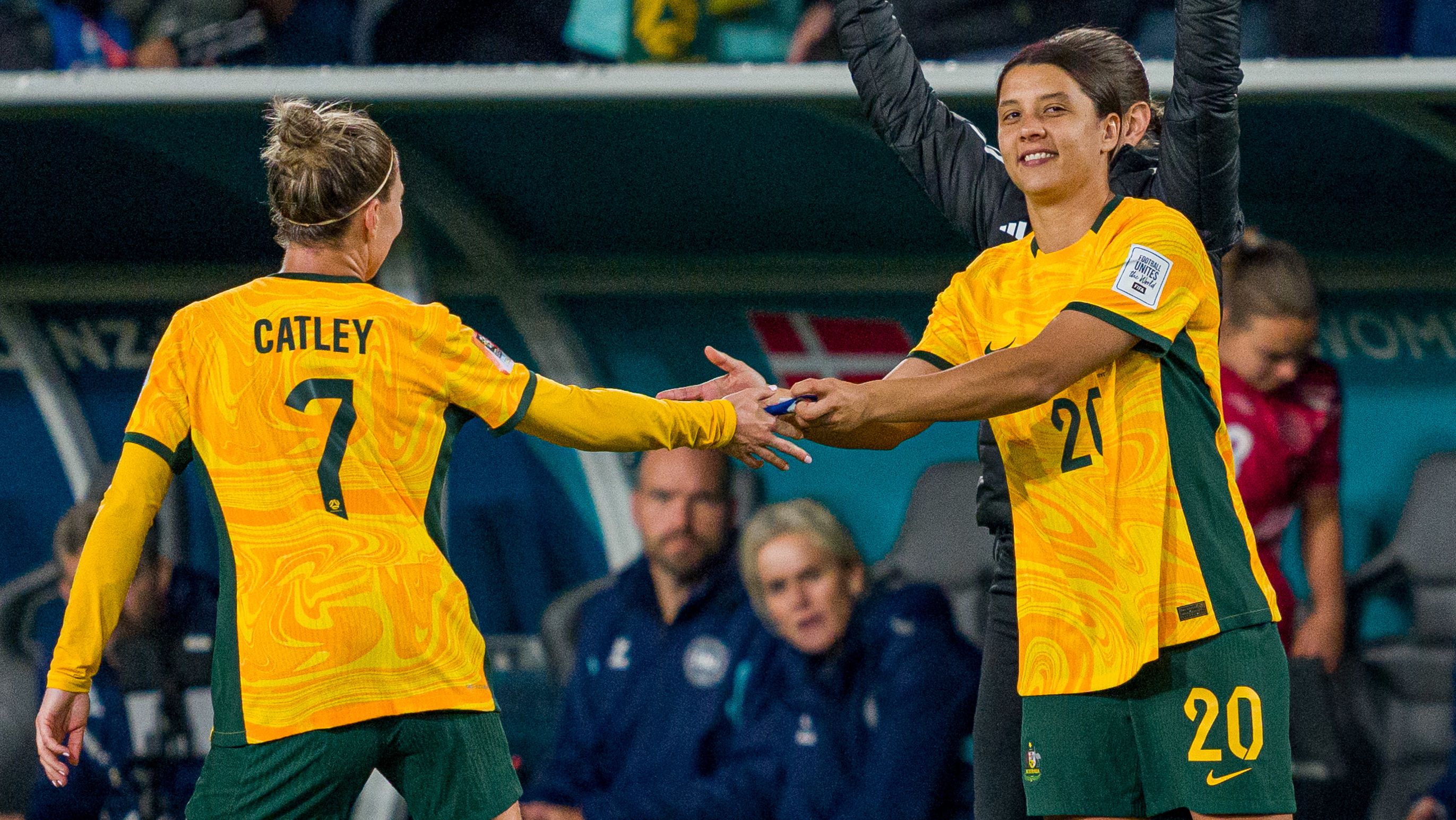 SYDNEY, AUSTRALIA - AUGUST 07: Steph Catley hands Sam Kerr the captain&#x27;s armband during the FIFA Women&#x27;s World Cup Australia &amp; New Zealand 2023 Round of 16 match between Australia and Denmark at Stadium Australia on August 07, 2023 in Sydney, Australia. (Photo by Andy Cheung/Getty Images)