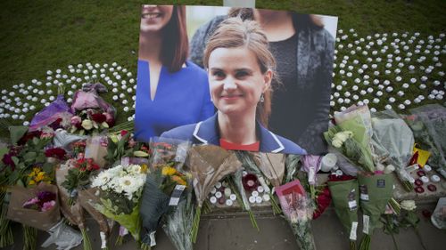 Tributes for Ms Cox in Parliament Square in London. (AAP)