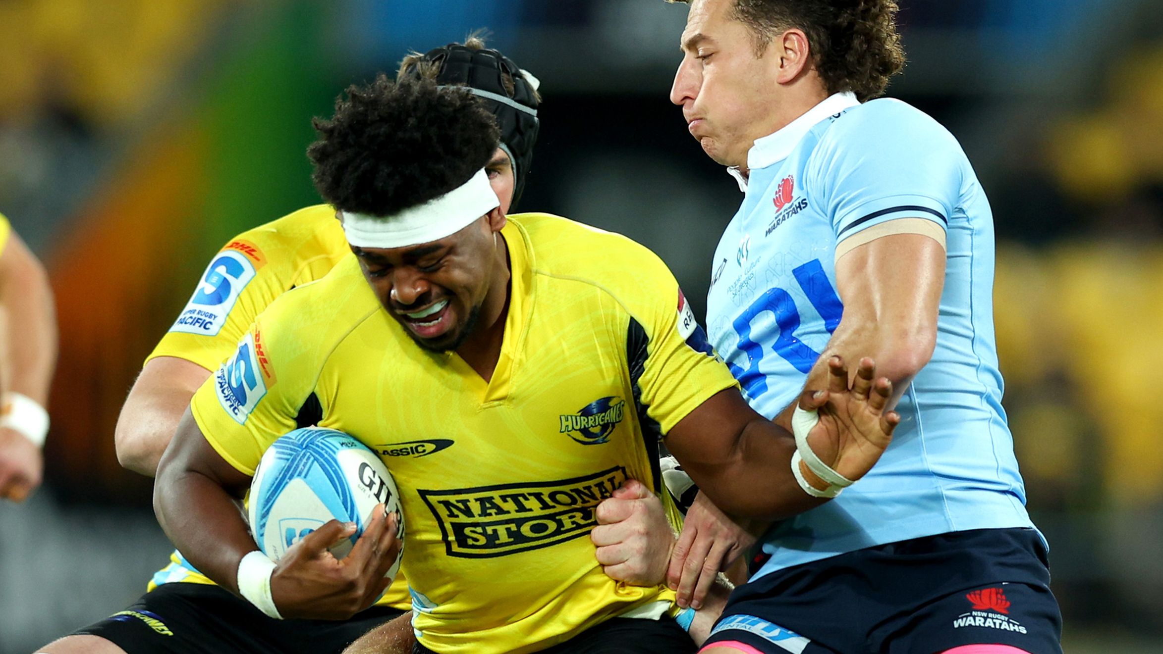 Peter Lakai of the Hurricanes is tackled during the round 11 Super Rugby Pacific match between Hurricanes and NSW Waratahs.