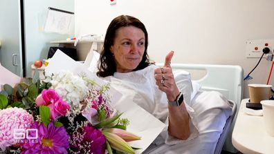 Michelle Hayton gives a thumbs up after a successful transplant surgery.