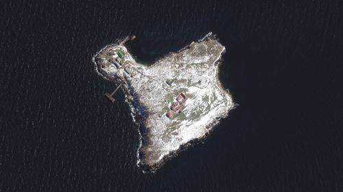The image, taken on Sunday by Maxar Technologies, shows damage to some buildings from Russian military strikes, as well as a Russian naval vessel anchored in the Black Sea.