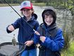 Ben and ﻿his older brother Russell, pictured fishing on the banks of a river.