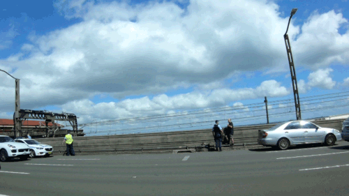 A car had stopped in one of the lanes and a man jumped out covered in blood.