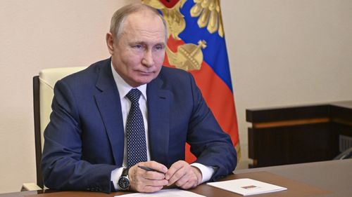Russian President Vladimir Putin takes part in the launch of a new ferry via a conference call at the Novo-Ogaryovo residence outside Moscow Moscow, Russia, Friday, March 4, 2022. 