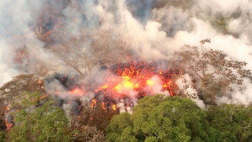 Lava splatters from an area between active Fissures 16 and 20 photographed on the lower east rift of the Kilauea volcano, near Pahoa, Hawaii. (AP)