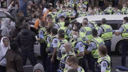 A person was arrested after a car was driven at police and protesters during a dawn operation at the parliament occupation.