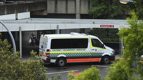 A patient transport service vehicle parked at the main entrance at Westmead Hospital, Westmead, NSW. 
