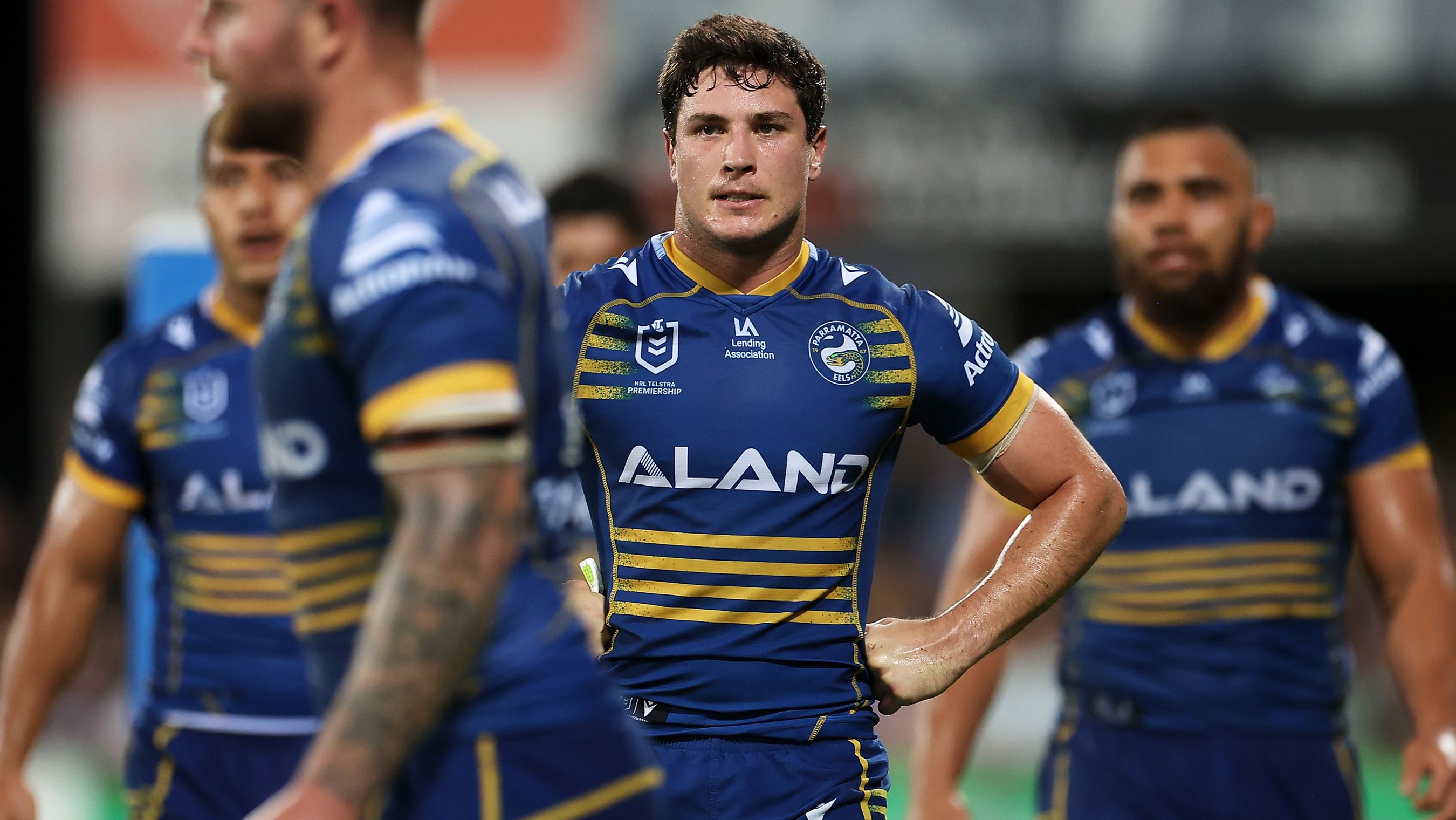 Mitchell Moses of the Eels and his teammates look dejected after a Cowboys try.