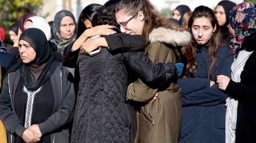 Women cry during the funeral for Aya Maasarwe.