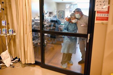 Anthony Church hugs Critical Care Nurse Emily Boucher, who cared for his daughter at Johnston Memorial Hospital in Virginia. 