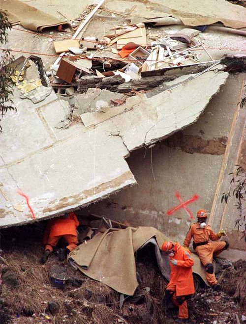 Rescue workers checking debris after the Thredbo landslide.