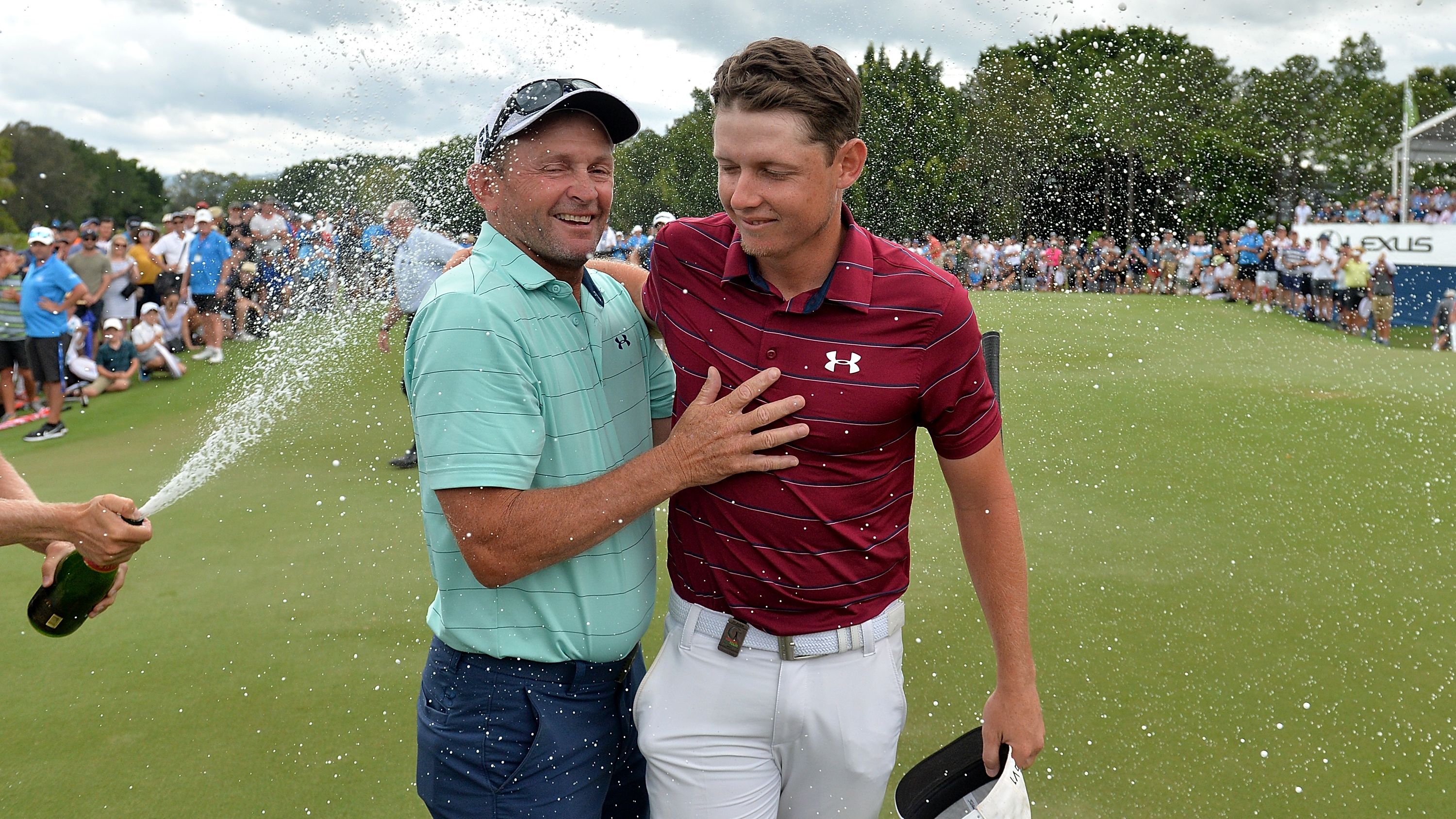 Cameron Smith celebrates with his father Des after taking victory at the 2017 Australian PGA Championship.