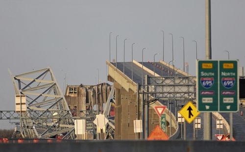 Parts of the Francis Scott Key Bridge remain after a container ship collided with a support Tuesday, March 26, 2024 in Baltimore. 