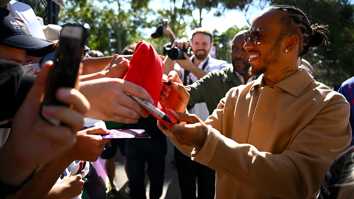 Lewis Hamilton greets fans on the Melbourne Walk prior to the 2023 Australian Grand Prix.