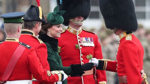 The Duchess of Cambridge presents shamrock to officers and guardsmen of 1st Battalion the Irish Guards. (PAA/AAP)