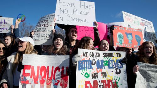 Students carried signs which read 'Stand United' and 'Enough is Enough'. (AP)