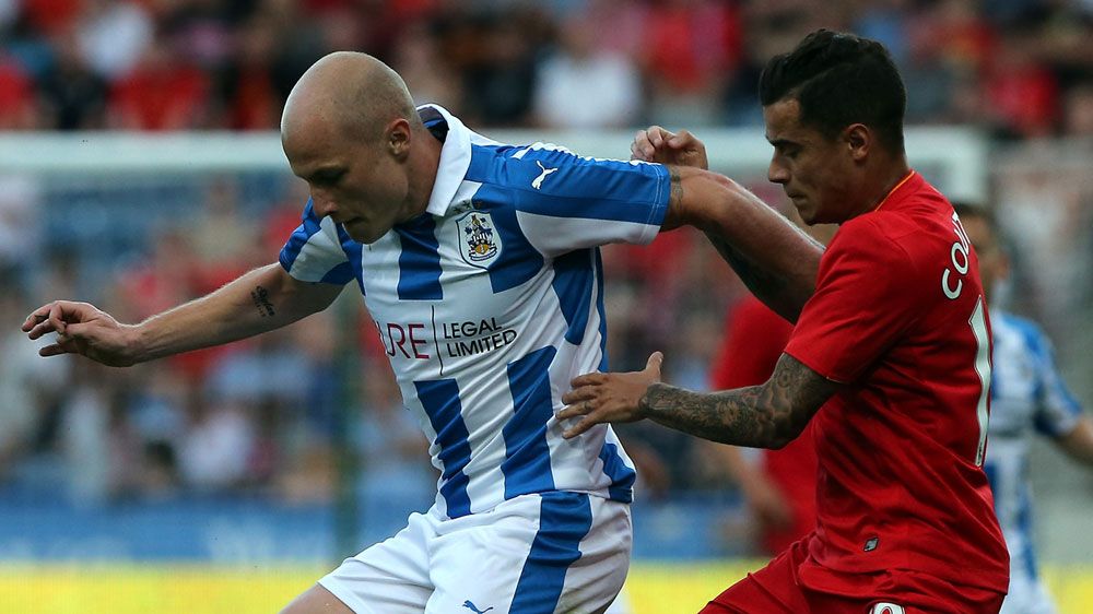 Aaron Mooy, left, holds off  Philippe Coutinho (Getty) 