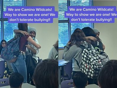 Young teenagers in school embracing and hugging in a classroom.