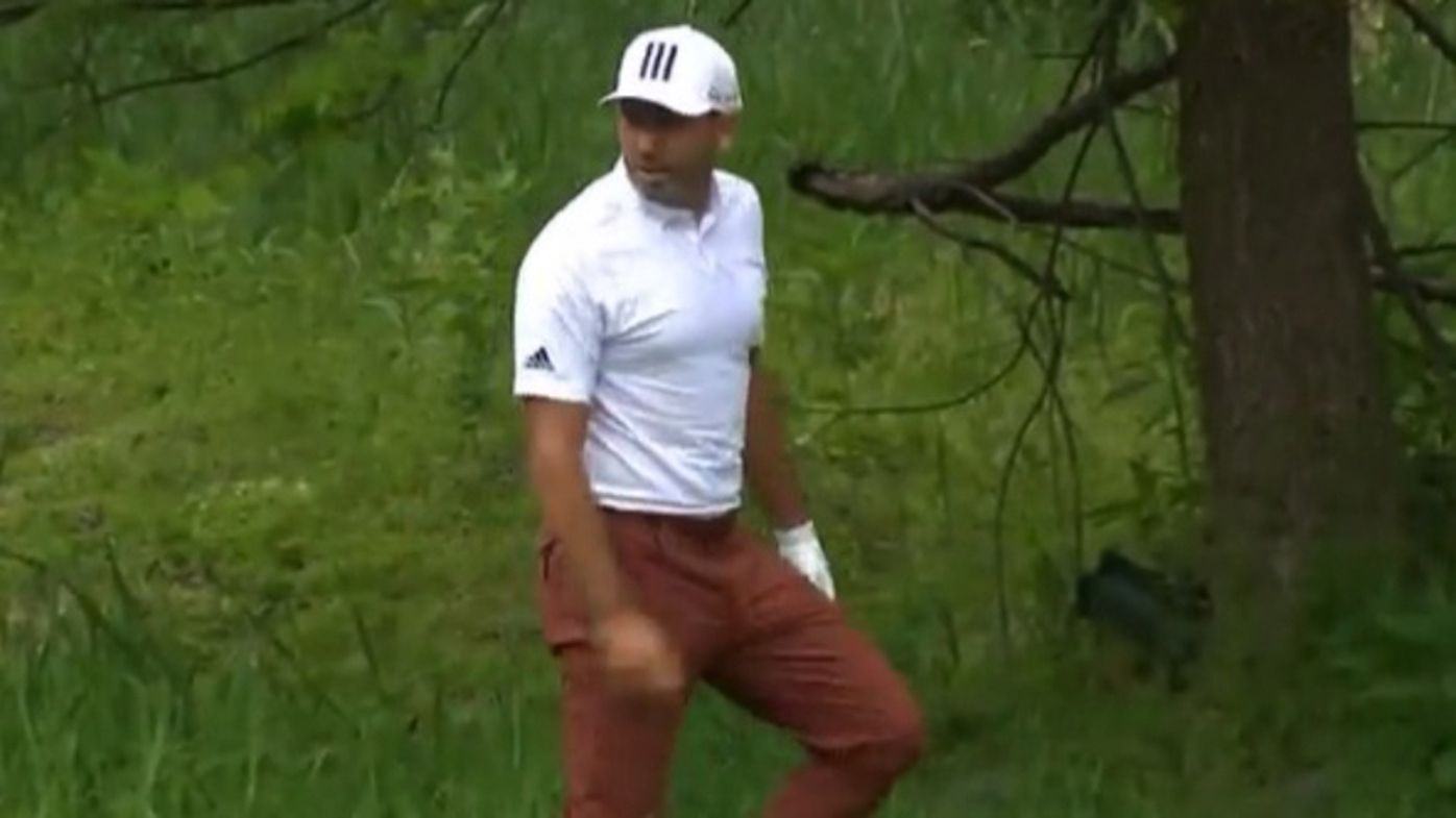 Sergio Garcia hunts for his lost ball at the Wells Fargo Championship.