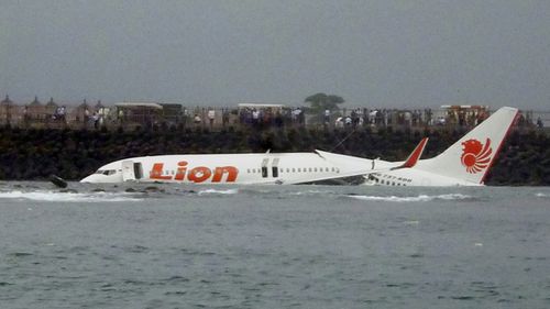 A crashed Lion Air plane is seen near the coastline of Bali's Ngurah Rai International Airport, Bali, Indonesia, 14 April 2013. 