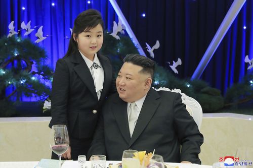 North Korean leader Kim Jong Un and his daughter attend a feast to mark the 75th founding anniversary of the Korean People's Army at an unspecified place in North Korea 
