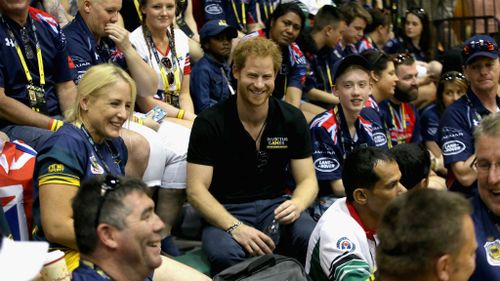 Prince Harry with Australian team and the crowd during the sit-down volleyball. (Chris Jackson/Getty/AFP)