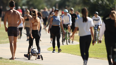 People walk along Miami foreshore on May 02, 2020 in Gold Coast, Australia.