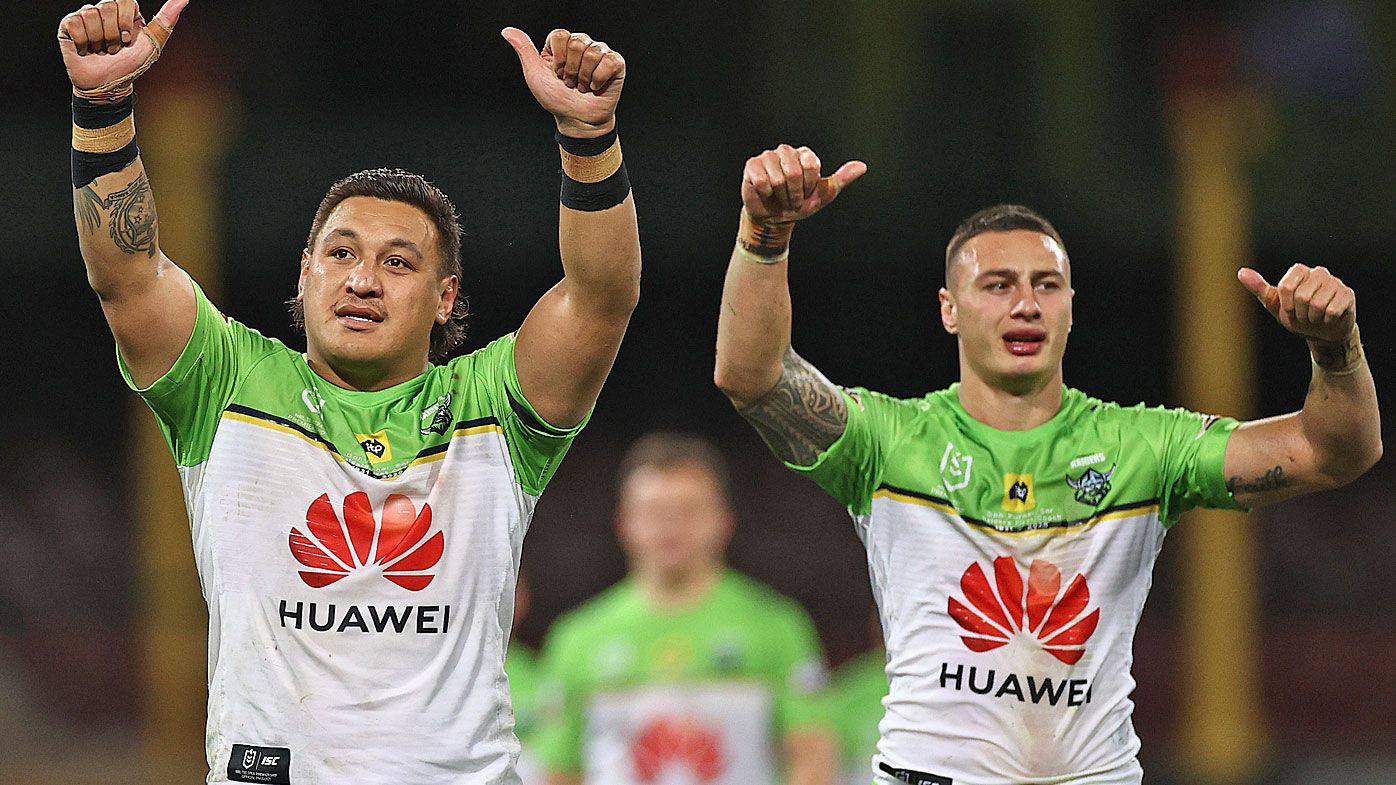 Josh Papalii and Charnze Nicoll-Klokstad wave to fans after the Raiders defeated the Roosters 
