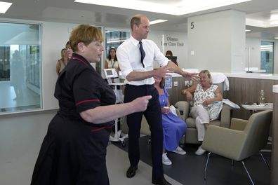 Prince William, centre, chats with the patients as he attends the official opening of the Oak Cancer Centre at The Royal Marsden Hospital in London, Thursday, June 8, 2023 