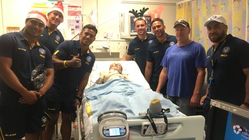 With a tight-knit community behind him, visits from a few of Louie's footy heroes have lifted his spirits. (Supplied)